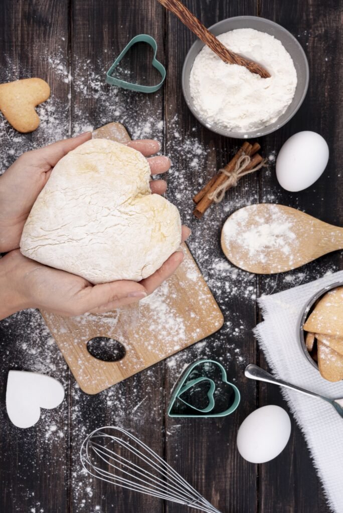 hands-holding-heart-shaped-dough (1) (1)